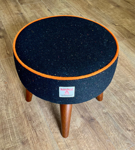 Black Speckled Harris Tweed Footstool with Orange Piping and Dark Varnished Wooden Legs