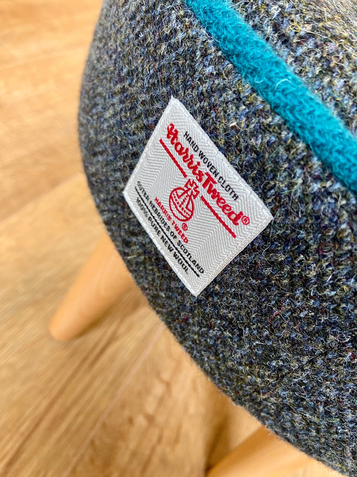 Charcoal Harris Tweed Footstool with Teal Piping and Varnished Wooden Legs